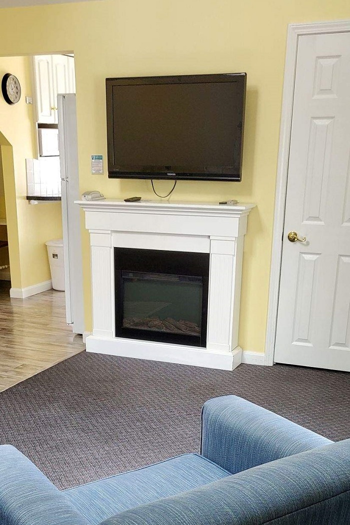 Enjoy the fireplace in Apartment 333's living room.